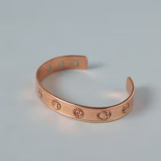 Chakra copper cuff. Crafted of pure copper with the mantras of the seven chakras engraved across its length