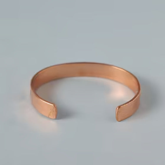 Chakra copper cuff. Crafted of pure copper with the mantras of the seven chakras engraved across its length