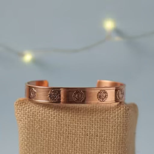 Chakra copper cuff. Crafted of pure copper with the mantras of the seven chakras engraved across its length