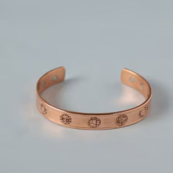 Chakra copper cuff. Crafted of pure copper with the mantras of the seven chakras engraved across its length